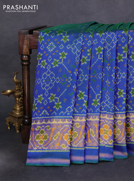 Rajkot patola silk saree dual shade of greenish blue with allover ikat weaves and ikat woven zari border