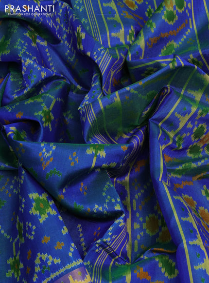 Rajkot patola silk saree dual shade of greenish blue with allover ikat weaves and ikat woven zari border