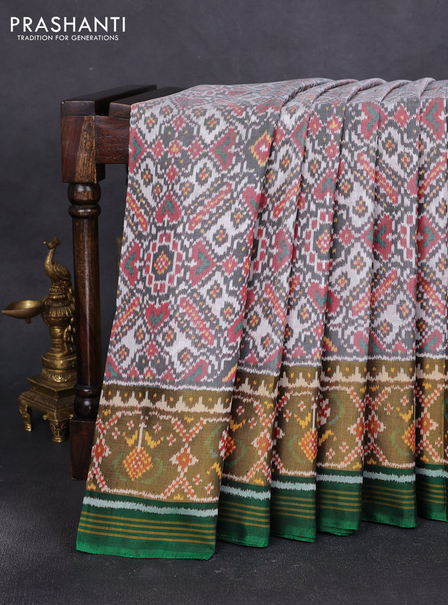 Rajkot patola silk saree off white  and green with allover ikat weaves and ikat woven zari border