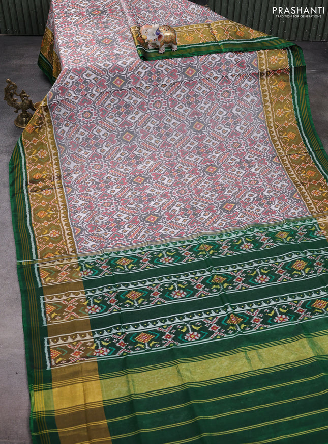 Rajkot patola silk saree off white  and green with allover ikat weaves and ikat woven zari border