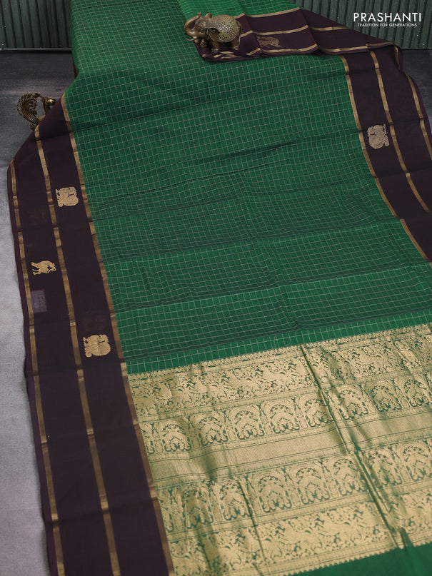 Kanchi cotton saree green and deep jamun with allover checked pattern and long zari woven simple border