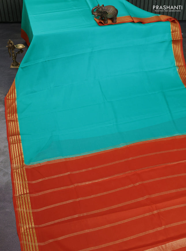 Pure mysore silk saree teal green and orange with plain body and zari woven border