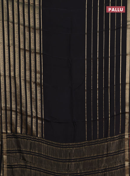 Semi mysore silk saree black and orange with plain body and long zari woven border