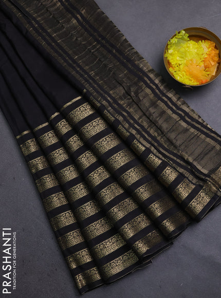 Semi mysore silk saree black and orange with plain body and long zari woven border