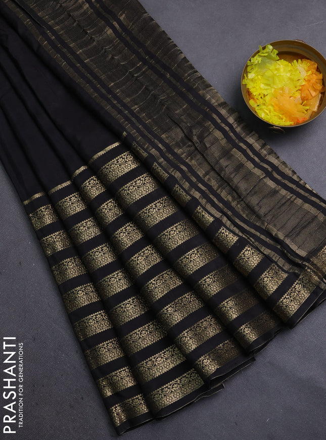 Semi mysore silk saree black and orange with plain body and long zari woven border