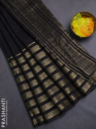 Semi mysore silk saree black and orange with plain body and long zari woven border
