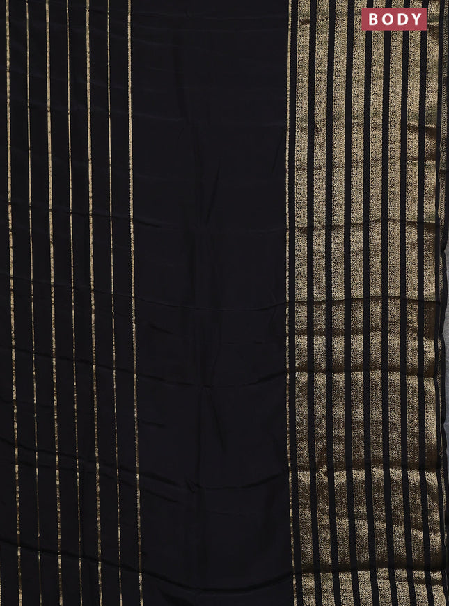 Semi mysore silk saree black and orange with plain body and long zari woven border