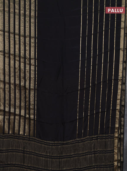 Semi mysore silk saree black and orange with plain body and long zari woven border