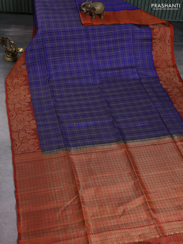 Kanchipuram soft silk saree blue and rustic orange with allover zari woven checked pattern and peacock design zari woven border