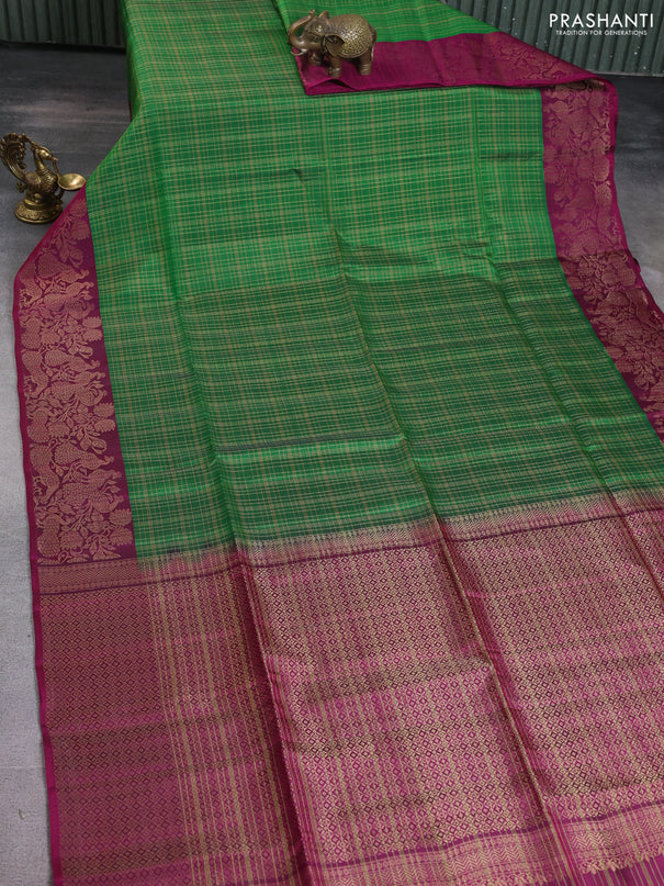 Kanchipuram soft silk saree green and dark magenta pink with allover zari woven checked pattern and peacock design zari woven border