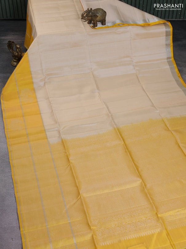 Kanchipuram soft silk saree cream and yellow with allover silver zari weaves and long silver zari woven annam border