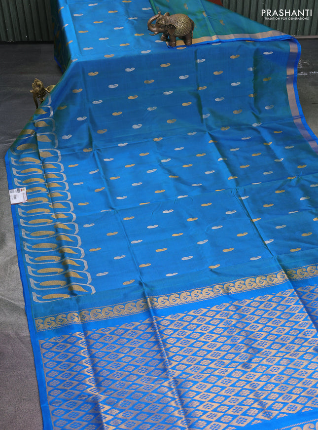 Pure uppada silk saree dual shade of cs blue with silver & gold paisley zari woven buttas and rich zari woven border