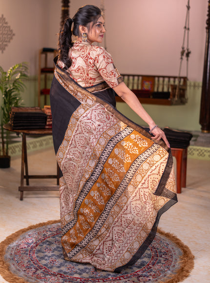 Chanderi bagru partly saree black and dark mustard with plain body and kalamkari printed pallu