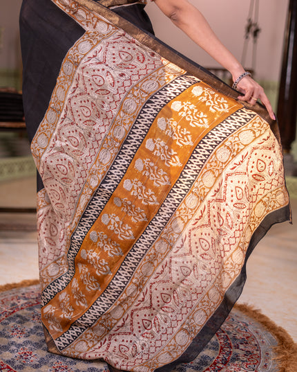 Chanderi bagru partly saree black and dark mustard with plain body and kalamkari printed pallu