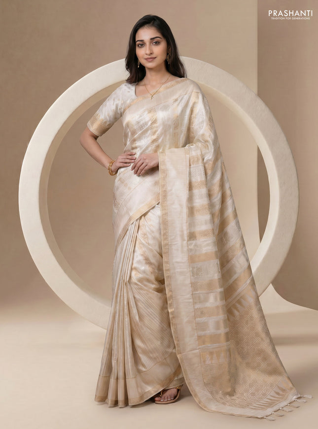 Semi kanchipuram partly saree off white with allover silver & zari weaves and rettapet zari woven border