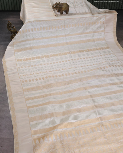 Semi kanchipuram partly saree off white with allover silver & zari weaves and rettapet zari woven border