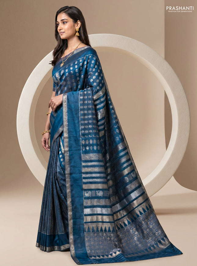 Semi kanchipuram partly saree peacock blue with allover silver & zari weaves and rettapet zari woven border