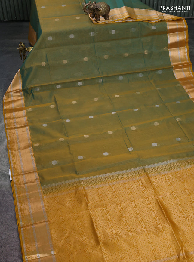 Kora silk cotton saree dual shade of teal greenish mustard and mustard yellow with silver & gold zari woven buttas and zari woven border