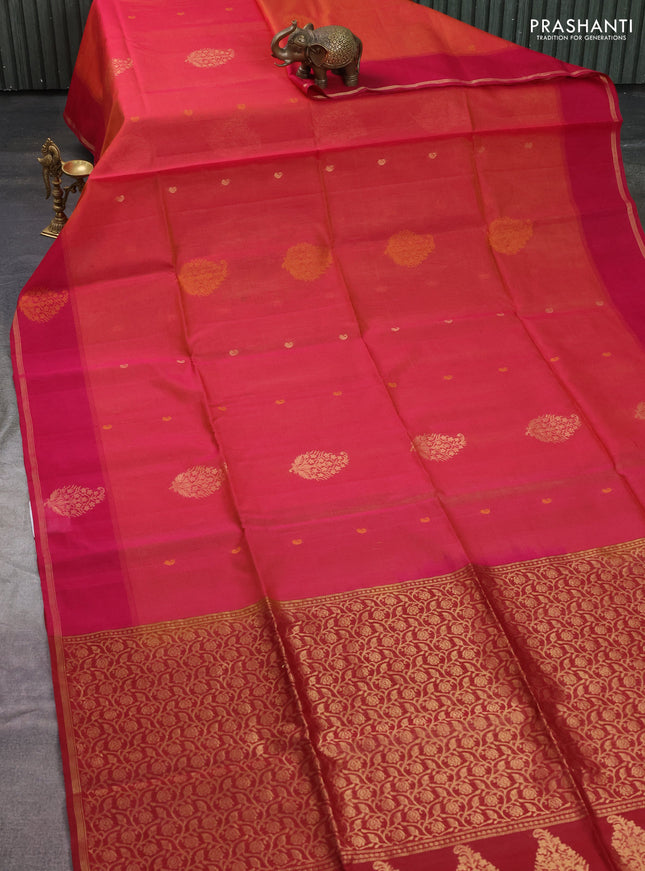 Kora silk cotton saree dual shade of pinkish orange and maroon with zari woven buttas and zari woven butta border