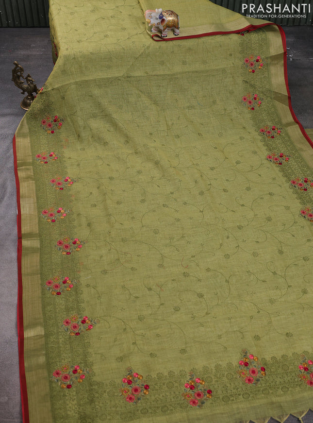 Linen cotton saree light green with allover embroidery work and embroidered zari border
