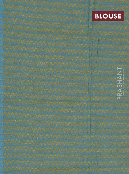 Chettinad cotton saree rust shade and teal green with allover small checked pattern and zari woven border