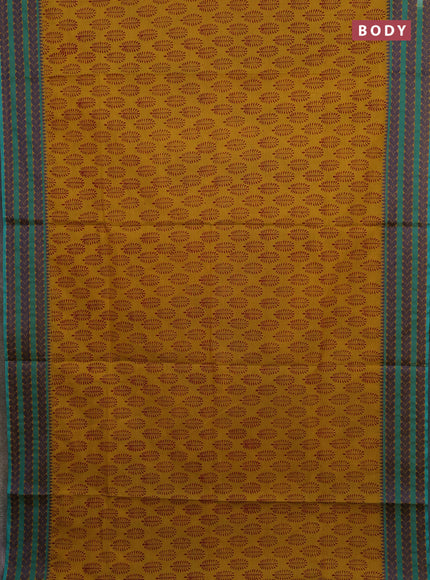 Chettinad cotton saree dark mustard and teal green with allover butta prints and thread woven border