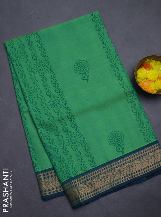 Chettinad cotton saree green and teal green with allover prints and temple thread woven border