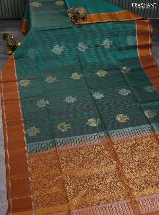Pure soft silk saree dual shade of green and dark mustard with allover zari weaves & buttas and zari woven border