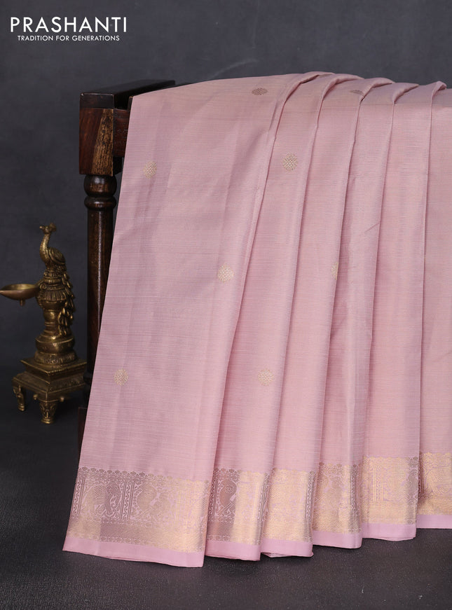 Pure kanchipuram silk saree pastel peach shade with allover zari weaves & buttas and rich zari woven border