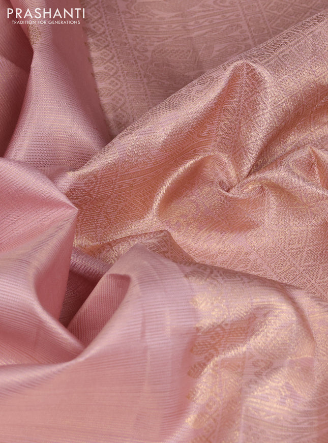 Pure kanchipuram silk saree pastel peach shade with allover zari weaves & buttas and rich zari woven border