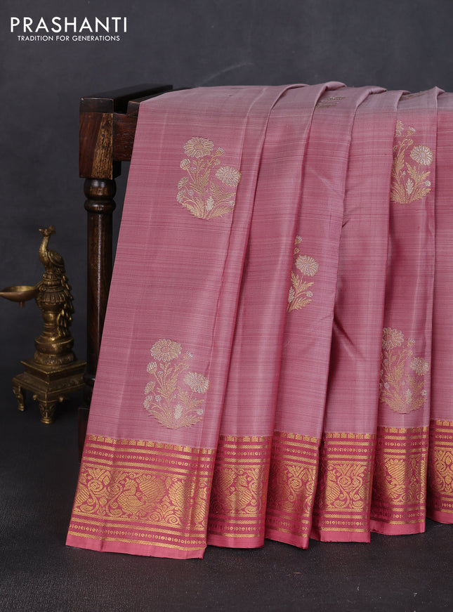 Pure kanchipuram silk saree pastel peach shade and peach shade with floral zari woven buttas and rich zari woven border