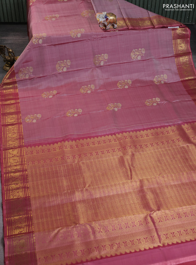 Pure kanchipuram silk saree pastel peach shade and peach shade with floral zari woven buttas and rich zari woven border