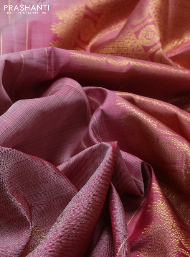 Pure kanchipuram silk saree pastel peach shade and peach shade with floral zari woven buttas and rich zari woven border