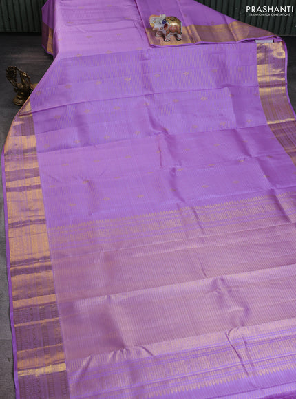 Pure kanchipuram silk saree lavender with allover zari strips & buttas and rich zari woven border