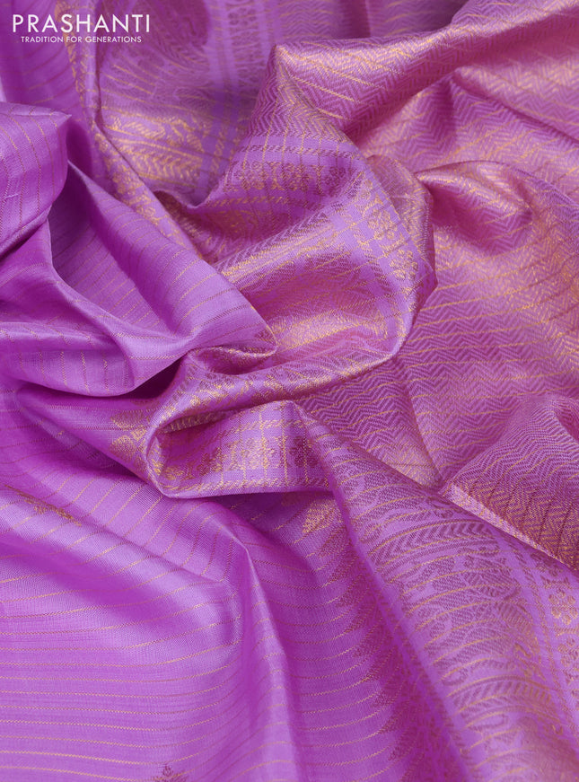 Pure kanchipuram silk saree lavender with allover zari strips & buttas and rich zari woven border