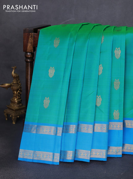 Pure kanchipuram silk saree dual shade of teal bluish green and cs blue with zari woven buttas and rettapet zari woven border