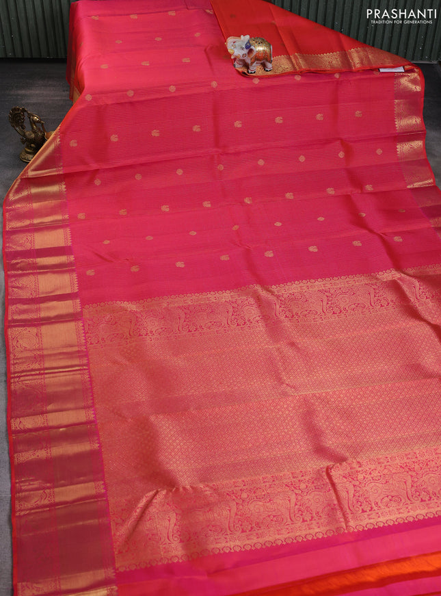 Pure kanchipuram silk saree dual shade of pinkish orange with allover zari weaves & buttas and long zari woven border