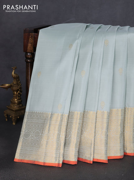 Pure kanchipuram silk saree pastel blue shade and orange with zari woven buttas and rich zari woven border