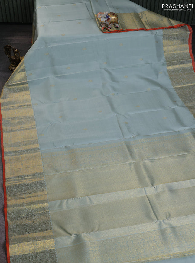 Pure kanchipuram silk saree pastel blue shade and orange with zari woven buttas and rich zari woven border