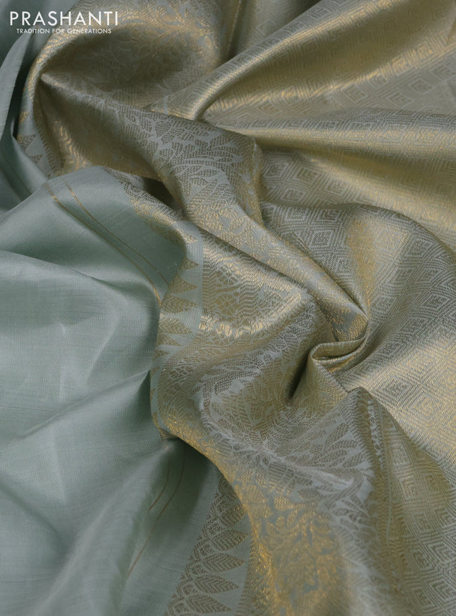 Pure kanchipuram silk saree pastel blue shade and orange with zari woven buttas and rich zari woven border