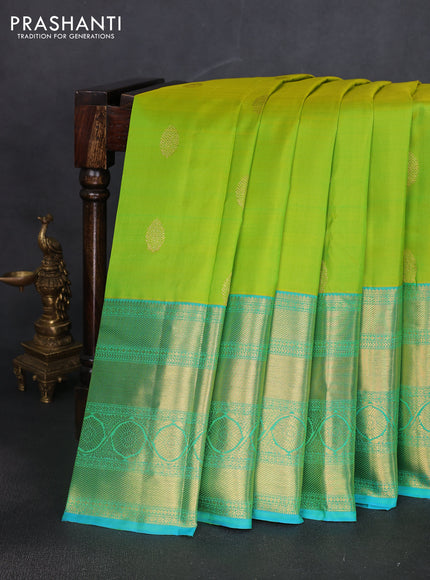Pure kanchipuram silk saree fluorescent green and teal blue with zari woven buttas and long zari woven border