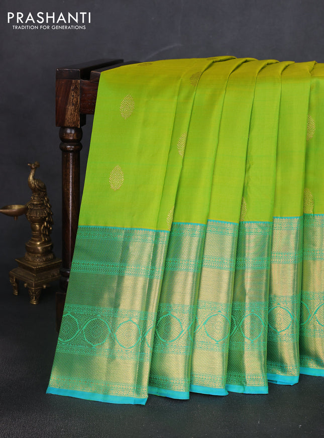 Pure kanchipuram silk saree fluorescent green and teal blue with zari woven buttas and long zari woven border