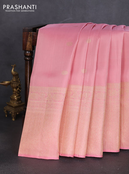 Pure kanchipuram silk saree peach shade with annam & rudhraksha zari woven buttas and long zari woven border