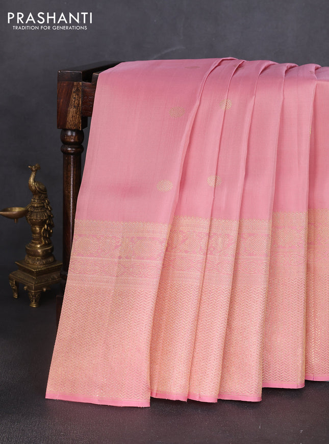 Pure kanchipuram silk saree peach shade with annam & rudhraksha zari woven buttas and long zari woven border