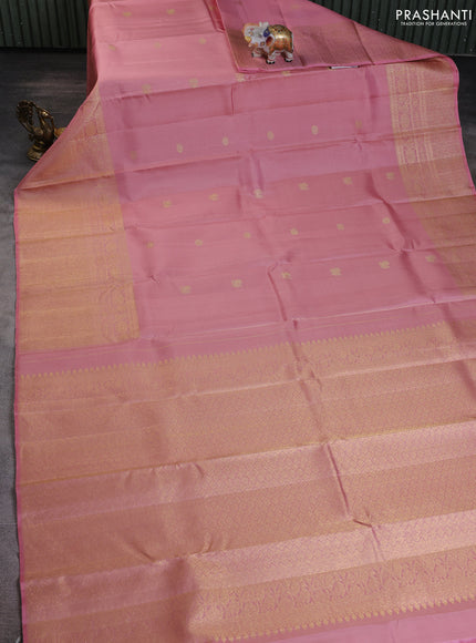 Pure kanchipuram silk saree peach shade with annam & rudhraksha zari woven buttas and long zari woven border