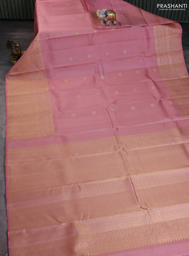 Pure kanchipuram silk saree peach shade with annam & rudhraksha zari woven buttas and long zari woven border