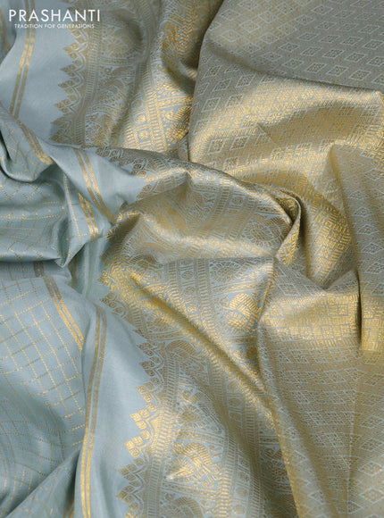Pure kanchipuram silk saree pastel blue shade with allover zari woven checked pattern and long rettapet zari woven border