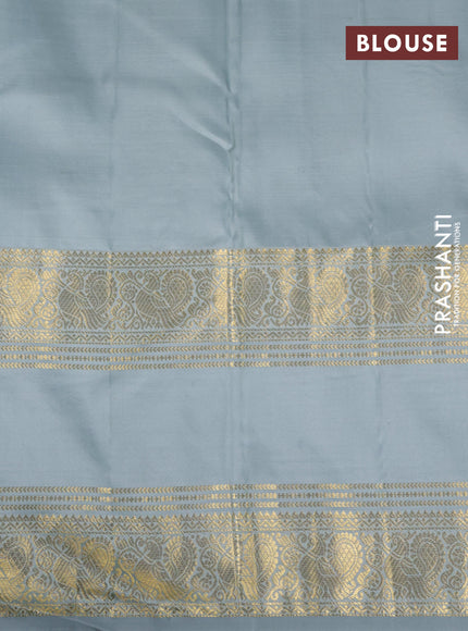 Pure kanchipuram silk saree pastel blue shade with allover zari woven checked pattern and long rettapet zari woven border