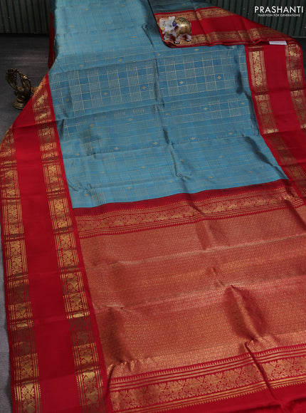 Pure kanchipuram silk saree pastel blue shade and red with allover zari checks & buttas and long zari woven border
