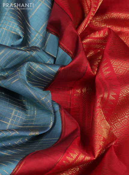 Pure kanchipuram silk saree pastel blue shade and red with allover zari checks & buttas and long zari woven border
